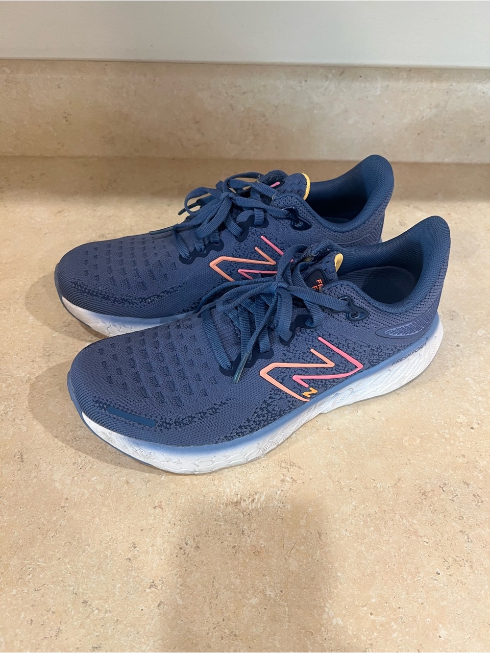 New Balance Womens Blue Running Shoes with Pink and Orange Accent